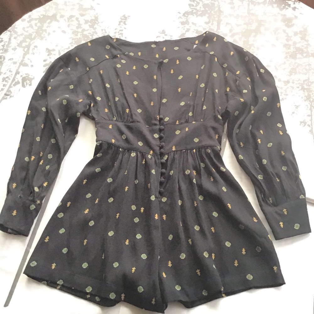 Free people love grows black romper. Size xs.